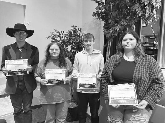 Karyl Boldt presented these special awards to her Timber Lake High School English students. L-R Kade Conner (The Student Has Become the Teacher Award); Molly Miller (Day Maker); Gavin Farlee, (Most Entertaining Argument); and Serenity Webb (Most Creative Writer).
