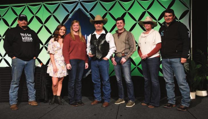 Zach Ducheneaux (CENTER) and the team at DX Ranch were recently honored as finalists for the 2021 Top Producer of the Year award at Farm Journal’s Top Producer Summit in Nashville. L-R are Bud Ducheneaux, Calico Ducheneaux, Melissa Loeschen, Zachary Ducheneaux, Ty Ducheneaux, Tausha Kraft-Ducheneaux, and Guthrie Ducheneaux. Not pictured: Kelsey Ducheneaux, Monte Scott, Burt Dillabaugh, and the rest of the family and friends back home on CRST. Photo by Chuck Zimmerman, Top Producer